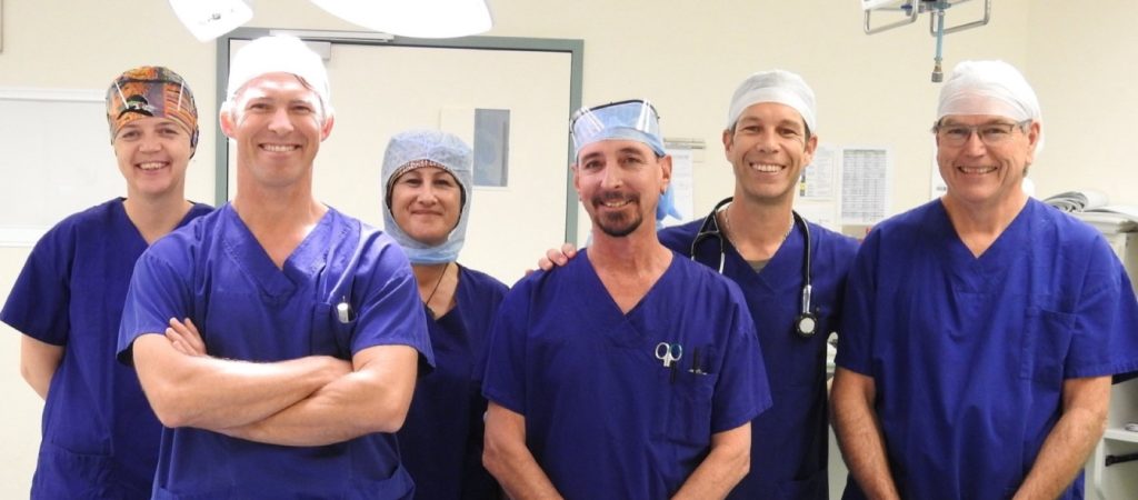 Dr Simon Smith with the theatre team